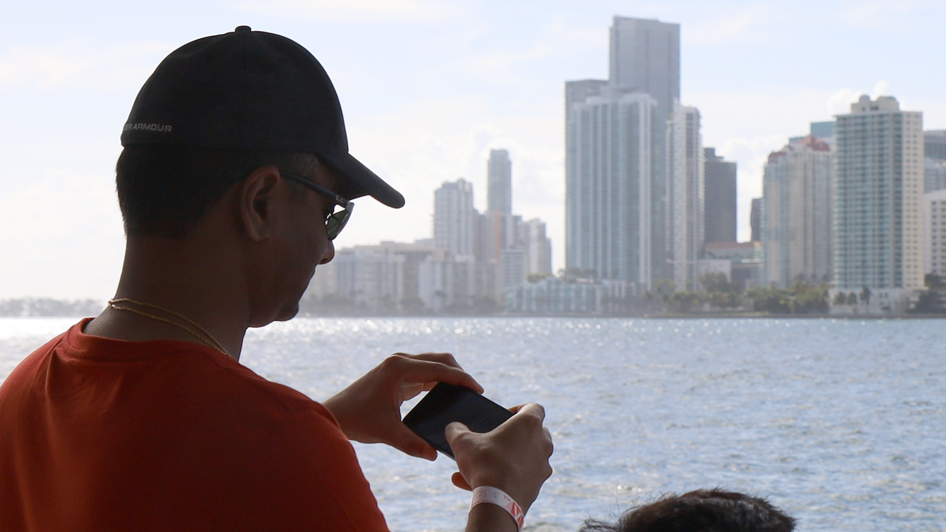 A man looks at his photos that he took during the cruise.